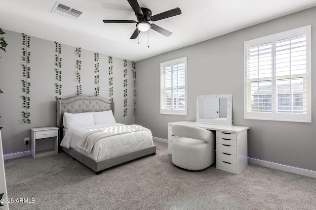 bedroom featuring ceiling fan and light colored carpet