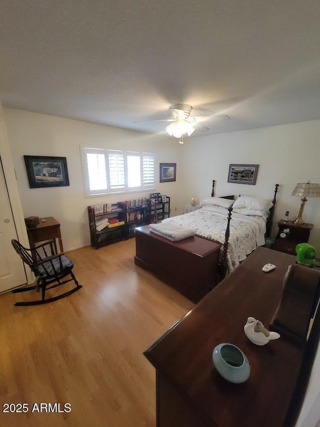 bedroom featuring ceiling fan and light wood finished floors