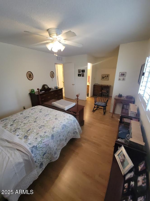 bedroom featuring light wood-type flooring and ceiling fan