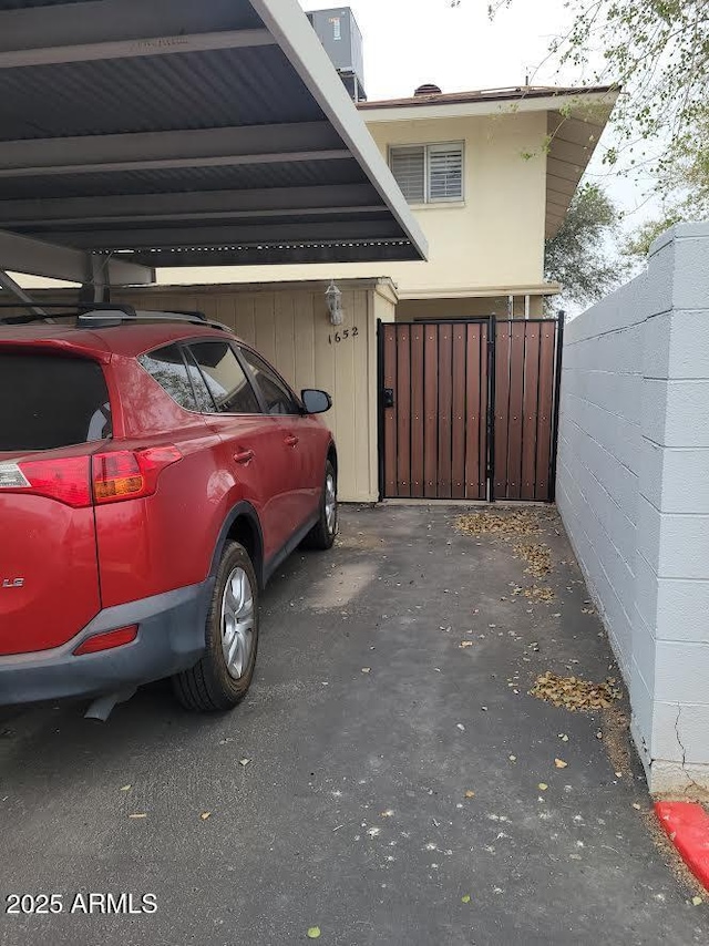 covered parking lot with fence