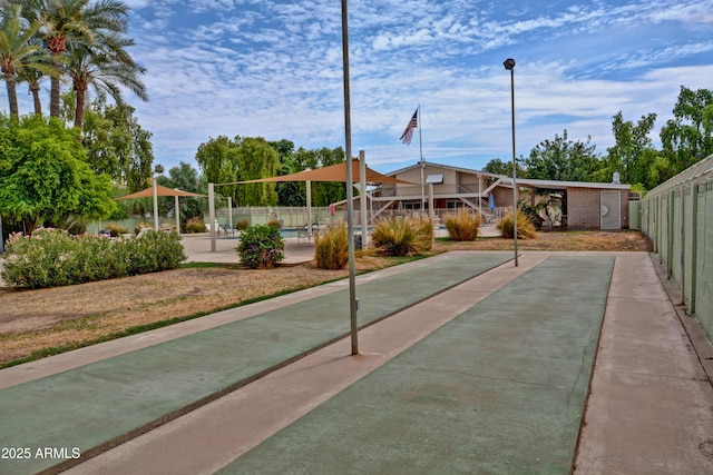 surrounding community featuring a patio area and fence