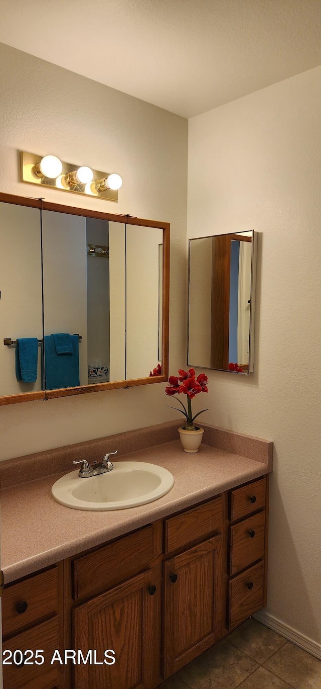 bathroom with vanity and tile patterned floors