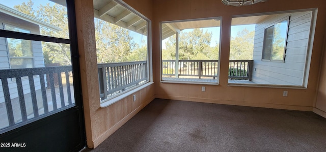 unfurnished sunroom featuring a wealth of natural light