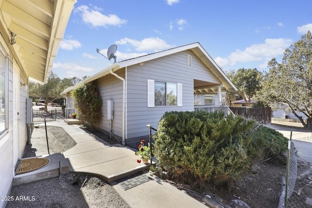 view of property exterior with a patio area