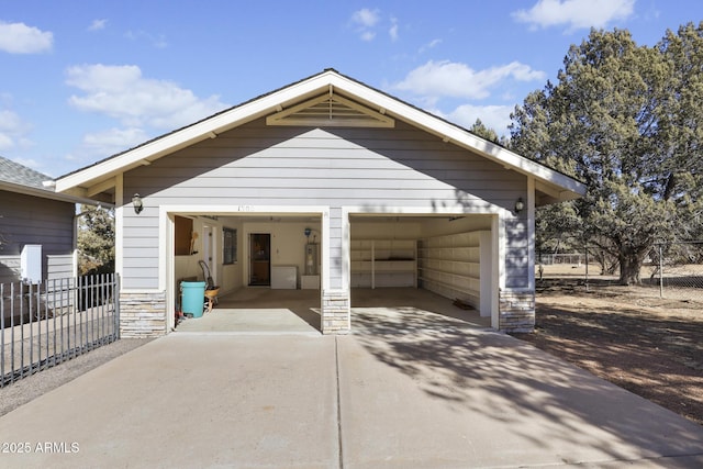 view of front of home featuring a garage and an outdoor structure