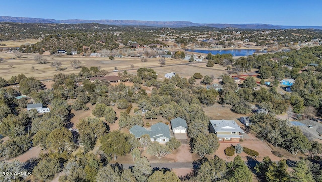 bird's eye view with a water and mountain view