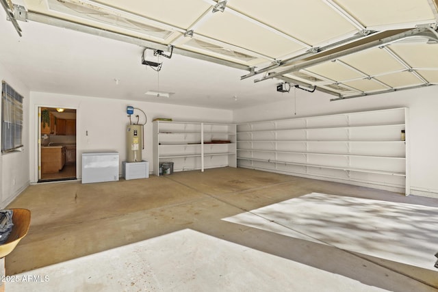 garage featuring a garage door opener, electric water heater, and refrigerator