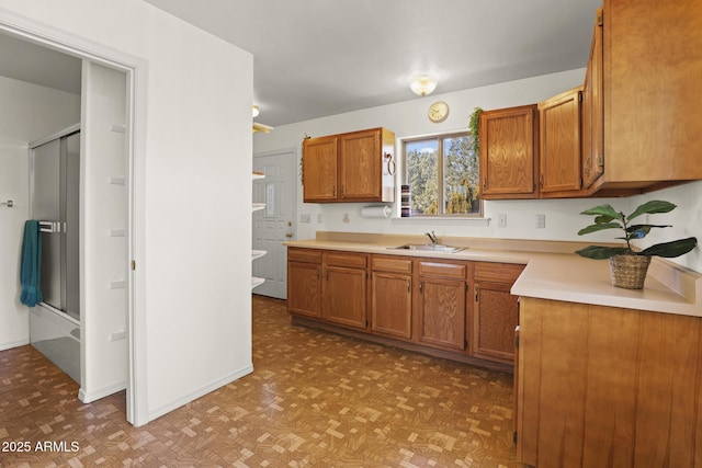 kitchen featuring light parquet floors and sink