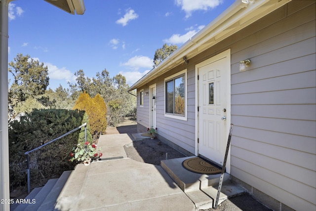 entrance to property with a patio