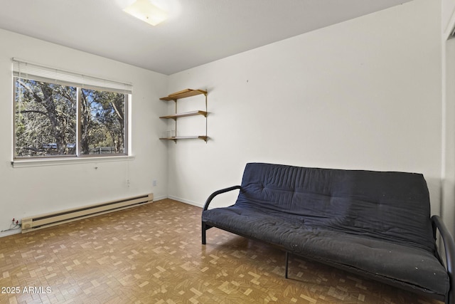 sitting room featuring a baseboard radiator and light parquet flooring