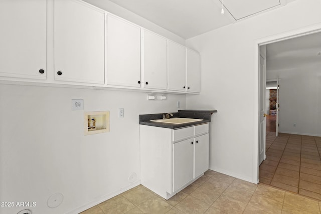 clothes washing area with gas dryer hookup, sink, light tile patterned floors, hookup for a washing machine, and electric dryer hookup