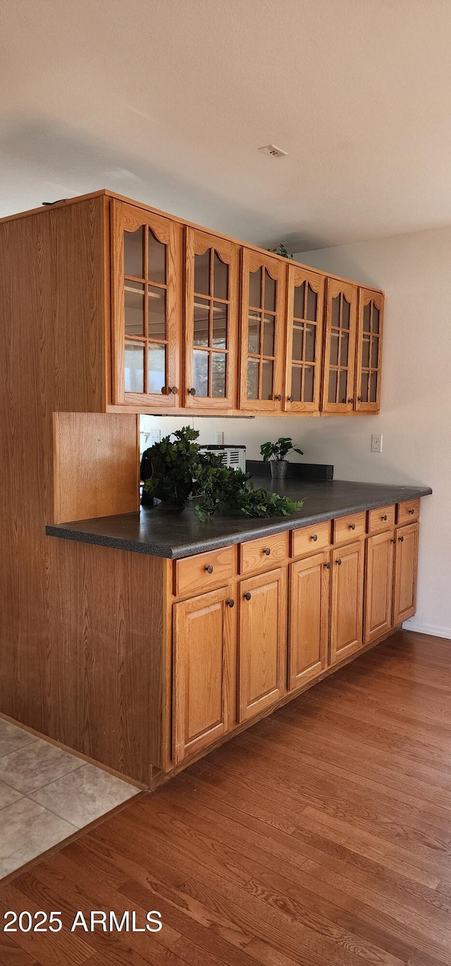 kitchen with dark hardwood / wood-style flooring