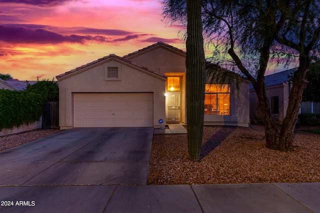 ranch-style home with a garage