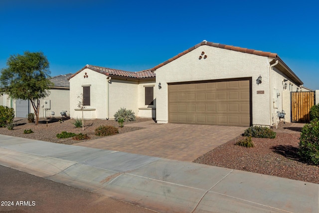 mediterranean / spanish house featuring a garage