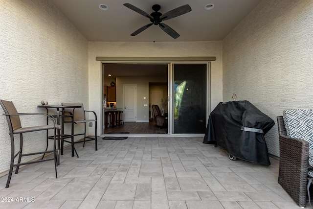 view of patio with grilling area and ceiling fan