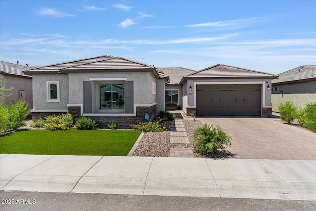 view of front of house with a garage and a front yard