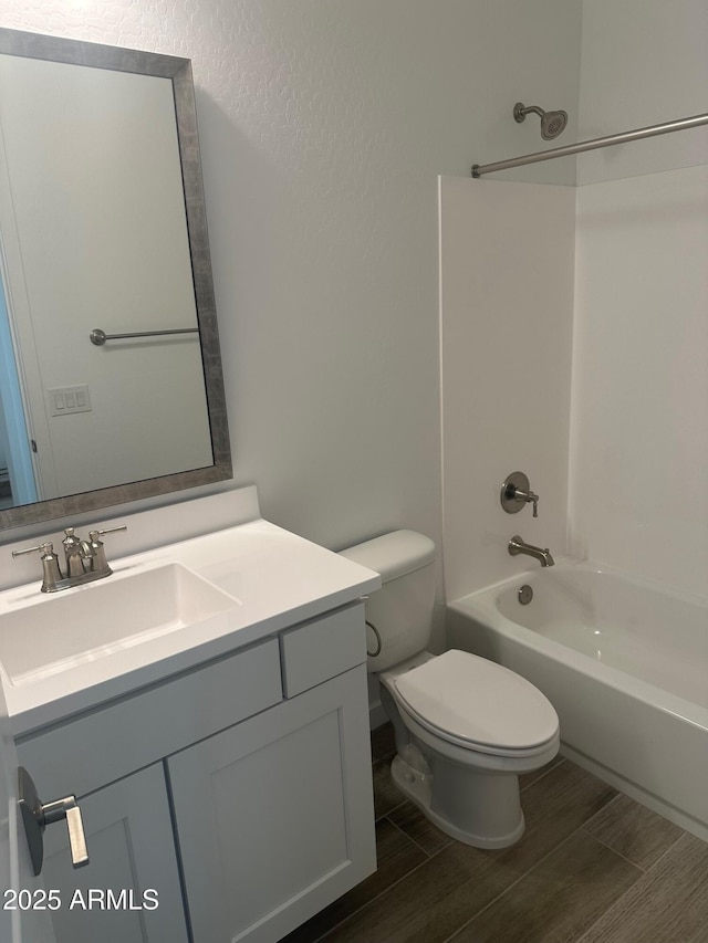 3637 E Rochelle Cir, Mesa, AZ 85213 - full bathroom with toilet,  shower combination, vanity, wood finished floors, and a textured wall