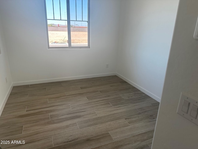 3637 E Rochelle Cir, Mesa, AZ 85213 - spare room with wood finished floors and baseboards