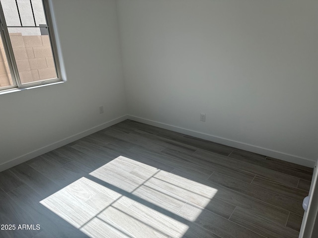 3637 E Rochelle Cir, Mesa, AZ 85213 - spare room featuring baseboards and dark wood-type flooring