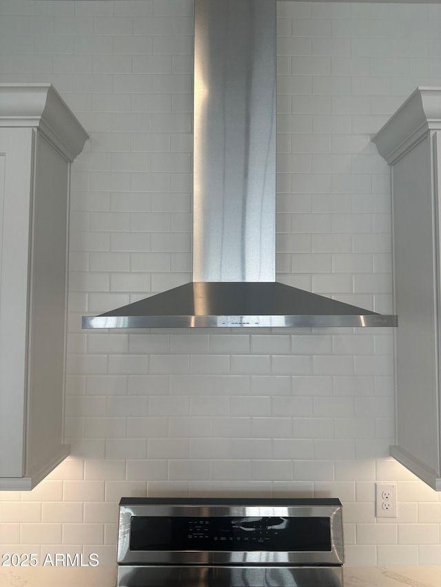 3637 E Rochelle Cir, Mesa, AZ 85213 - kitchen view of wall chimney exhaust hood, tasteful backsplash, and range