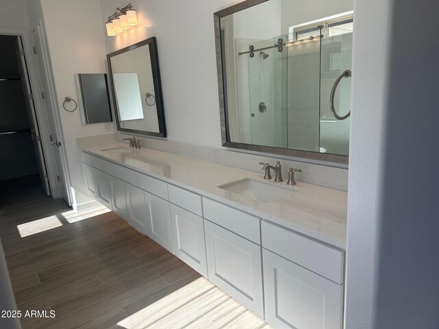 3637 E Rochelle Cir, Mesa, AZ 85213 - full bathroom featuring a shower stall, double vanity, and wood finished floors
