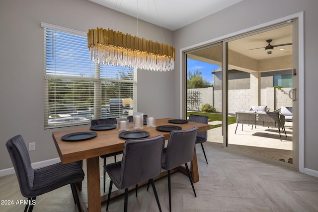 dining area featuring ceiling fan and light parquet floors