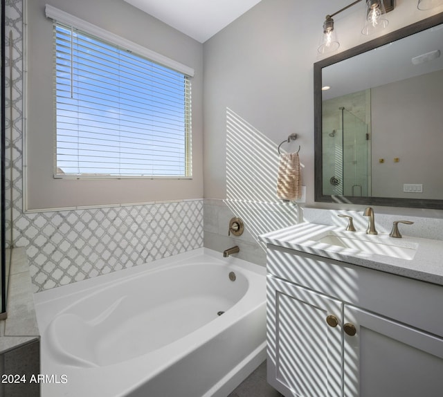 bathroom featuring a bathing tub and vanity