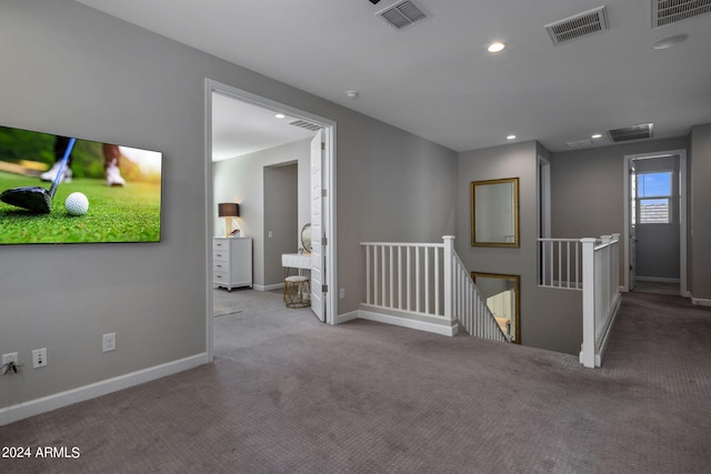 spare room featuring carpet floors