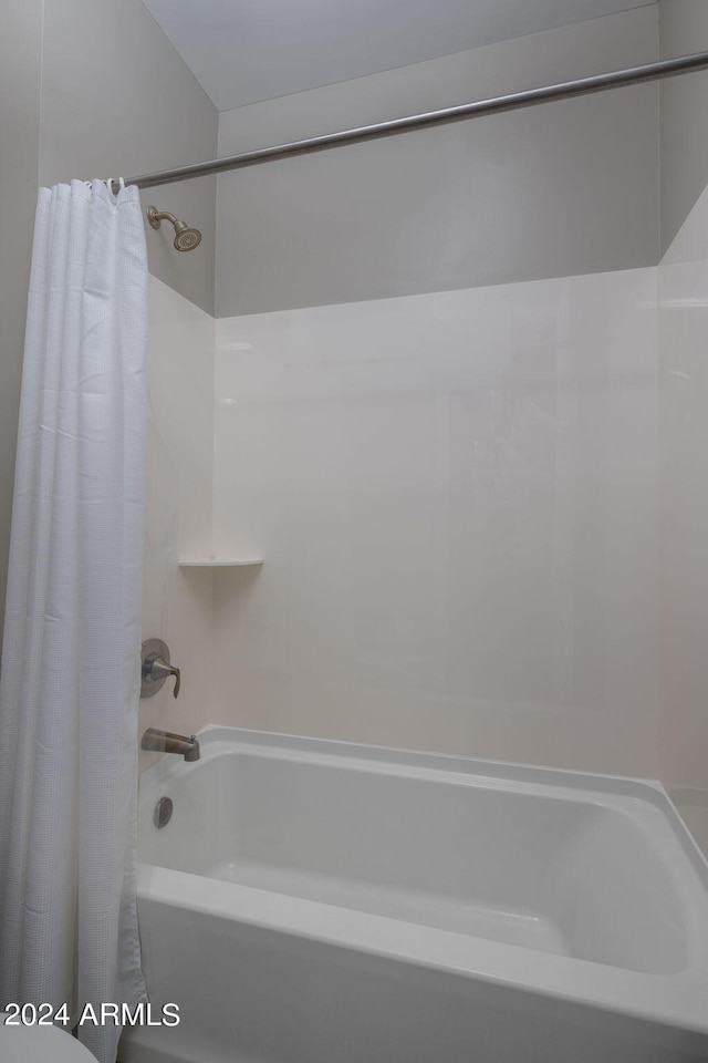 bathroom featuring shower / bath combination with curtain