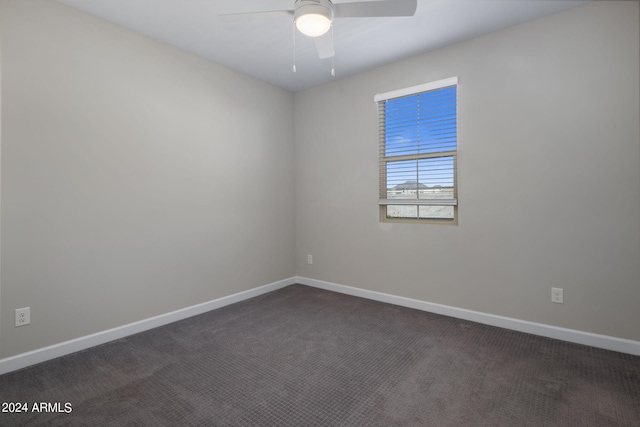 empty room featuring ceiling fan and carpet flooring