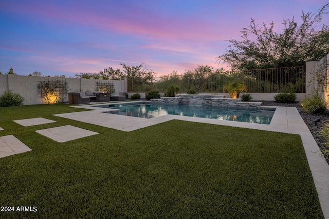 pool at dusk with a yard