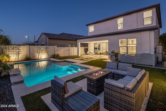 view of swimming pool featuring an outdoor living space with a fire pit, a jacuzzi, and a patio