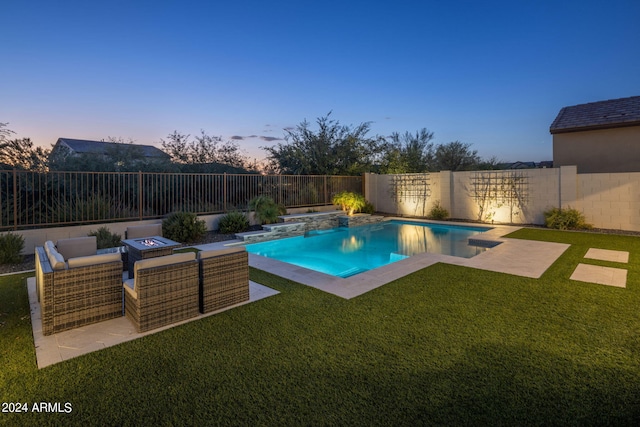 pool at dusk with a patio and a yard