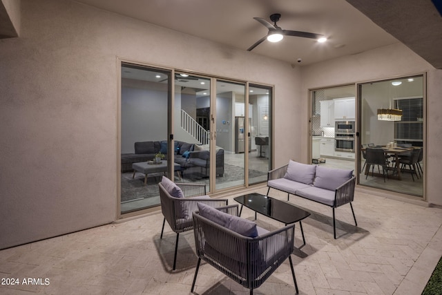 view of patio / terrace featuring ceiling fan and an outdoor living space