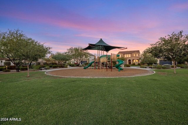 playground at dusk with a lawn