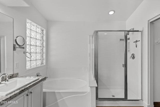 9631 E Palm Ridge Dr, Scottsdale, AZ 85260 - full bathroom with a stall shower, vanity, a garden tub, and recessed lighting