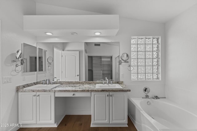 9631 E Palm Ridge Dr, Scottsdale, AZ 85260 - full bathroom with vaulted ceiling, double vanity, a garden tub, and wood finished floors