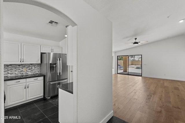 9631 E Palm Ridge Dr, Scottsdale, AZ 85260 - kitchen with stainless steel refrigerator with ice dispenser, decorative backsplash, white cabinets, a ceiling fan, and lofted ceiling