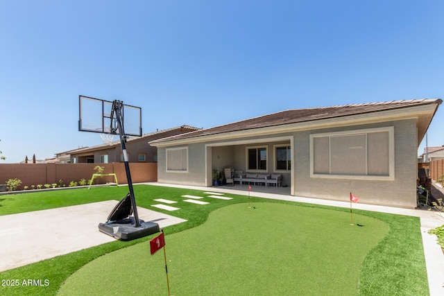 11015 E Texas Ave, Mesa, AZ 85212 - back of property with a putting green, a patio area, a fenced backyard, and stucco siding