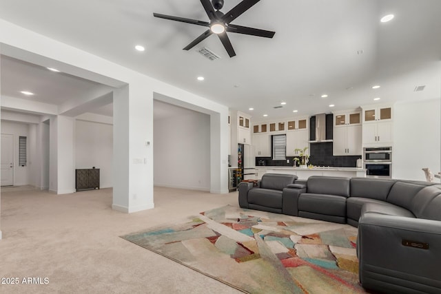 11015 E Texas Ave, Mesa, AZ 85212 - living area featuring light carpet, a ceiling fan, and recessed lighting