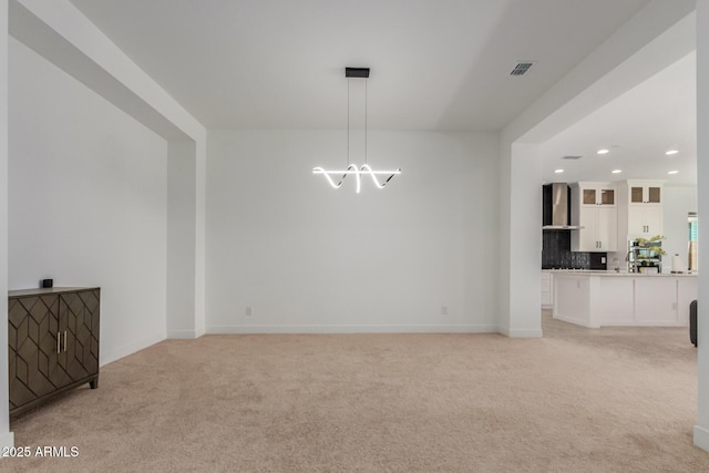 11015 E Texas Ave, Mesa, AZ 85212 - unfurnished living room featuring light colored carpet, recessed lighting, and a chandelier