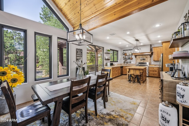 dining space with a notable chandelier, wooden ceiling, lofted ceiling, and light tile patterned floors