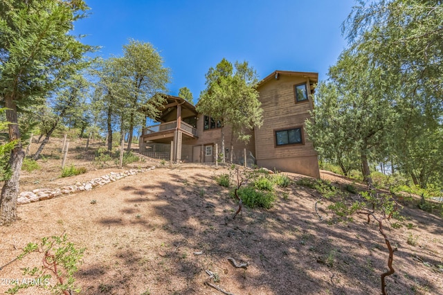 back of property featuring a deck