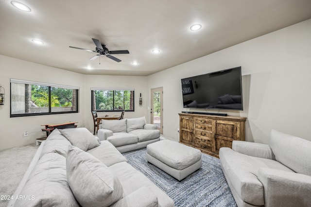 living room with carpet flooring and ceiling fan