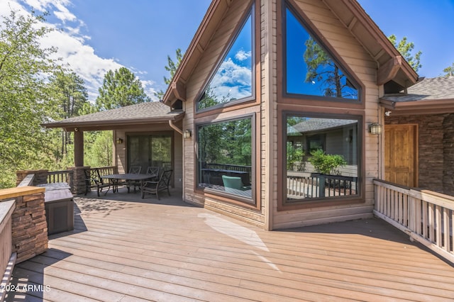 wooden terrace with outdoor dining space