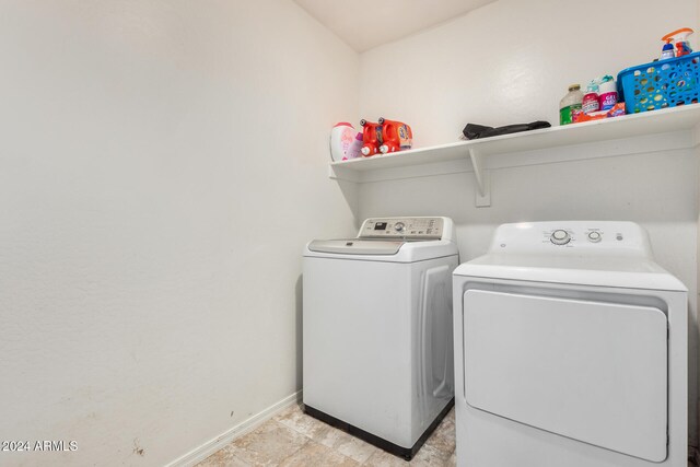 clothes washing area featuring washing machine and dryer