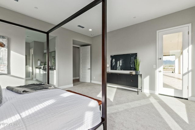 bedroom featuring light colored carpet