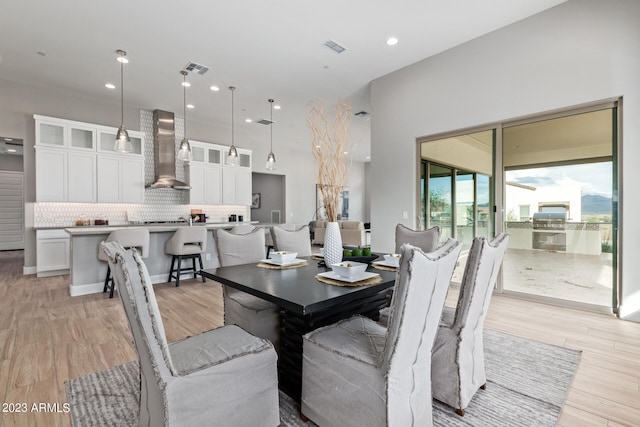 dining area with light wood-type flooring