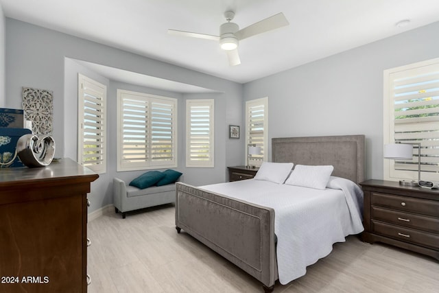 bedroom featuring ceiling fan and light hardwood / wood-style floors