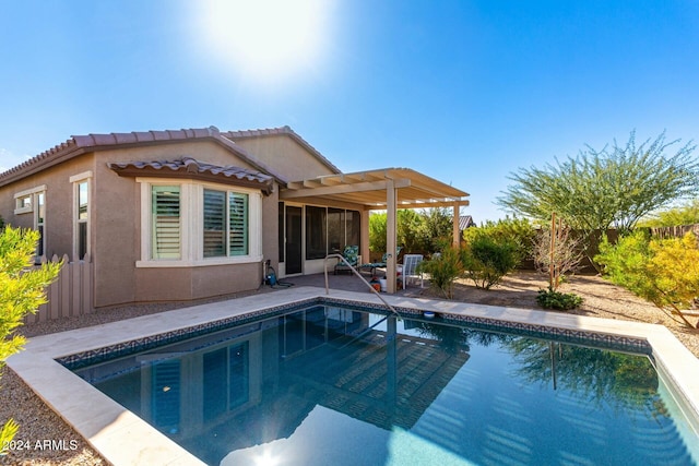 back of house with a pergola and a patio